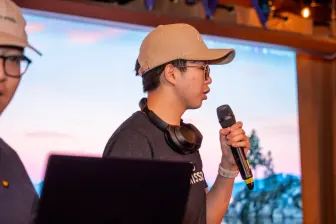 A presenter with a microphone