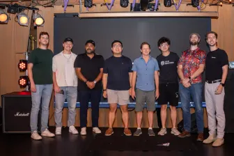 Nine lined up on the stage